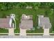 Aerial view of a landscaped backyard with a patio and mature trees at 1393 Turfway Dr, Avon, IN 46123