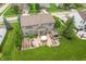 Aerial view of the home's landscaped backyard and patio with outdoor seating and grill at 1393 Turfway Dr, Avon, IN 46123