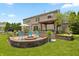 Spacious backyard featuring a fire pit and outdoor kitchen at 1393 Turfway Dr, Avon, IN 46123