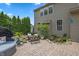 Charming patio area with a cozy seating and a tranquil pond at 1393 Turfway Dr, Avon, IN 46123