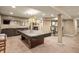 Finished basement with a pool table, bar, and comfortable seating area offers ample entertainment space at 1393 Turfway Dr, Avon, IN 46123