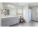 Bright bathroom featuring a double sink vanity with ample storage, stylish fixtures and a large mirror at 1393 Turfway Dr, Avon, IN 46123