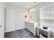 Bathroom featuring a double sink vanity with ample storage, stylish fixtures, large mirror and natural light at 1393 Turfway Dr, Avon, IN 46123