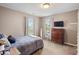 Comfortable bedroom with two windows, a dresser, and a cozy bed offers a relaxing private space at 1393 Turfway Dr, Avon, IN 46123