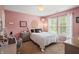 Charming pink bedroom with a polka dot bedspread, vanity, and natural light creates a warm atmosphere at 1393 Turfway Dr, Avon, IN 46123