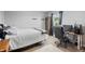 Simple bedroom with a white bed, a desk with chair, and natural light creates a functional workspace at 1393 Turfway Dr, Avon, IN 46123