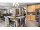 Dining area is adjacent to the kitchen and living room, offering hardwood floors and a chandelier at 1393 Turfway Dr, Avon, IN 46123