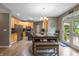 Open-concept dining room next to the kitchen area features hardwood floors and access to an outdoor patio at 1393 Turfway Dr, Avon, IN 46123