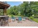 Outdoor fire pit area with chairs and lush greenery at 1393 Turfway Dr, Avon, IN 46123