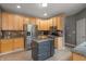 Well-equipped kitchen featuring stainless steel appliances, granite countertops, a central island, and ample cabinetry at 1393 Turfway Dr, Avon, IN 46123