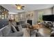 Inviting living room featuring a cozy fireplace, plush sectional, and an open layout to the kitchen at 1393 Turfway Dr, Avon, IN 46123