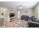 Inviting living room featuring a gray sofa, a ceiling fan, and doorway to additional living spaces at 1393 Turfway Dr, Avon, IN 46123