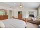 Spacious main bedroom with vaulted ceilings, ceiling fan, and a sitting area offers a relaxing retreat at 1393 Turfway Dr, Avon, IN 46123