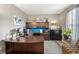 Cozy home office featuring custom built-ins, a spacious desk, and a comfortable seating area at 1393 Turfway Dr, Avon, IN 46123