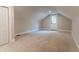 Spacious attic features neutral walls and plush carpeting, plus a door to the outside at 14407 Bryn Mawr Dr, Fishers, IN 46038