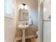 This bathroom boasts a pedestal sink, brushed nickel finishes, and a glass enclosed shower at 14407 Bryn Mawr Dr, Fishers, IN 46038
