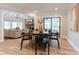 Bright dining area with a wooden table, seating for six, and seamless flow to living spaces at 14407 Bryn Mawr Dr, Fishers, IN 46038