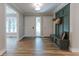 Bright entryway with tiled floors, storage bench, and direct access to multiple rooms at 14407 Bryn Mawr Dr, Fishers, IN 46038