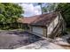Sprawling home exterior featuring a large driveway, attached garage, and an exterior staircase at 14407 Bryn Mawr Dr, Fishers, IN 46038