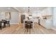Bright kitchen with stainless appliances, white cabinets, subway tile backsplash, and center island at 14407 Bryn Mawr Dr, Fishers, IN 46038