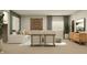 Cozy living room with sectional sofa, natural textures, and modern furnishings at 15424 Manderley St, Fishers, IN 46040