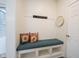 Inviting entryway with a built-in bench, storage, and coat hooks at 1580 Mairn Ave, Carmel, IN 46032