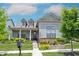 Charming two-story home with landscaped front yard and welcoming porch at 1580 Mairn Ave, Carmel, IN 46032