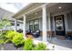 Inviting front porch with chairs and potted plants at 1580 Mairn Ave, Carmel, IN 46032