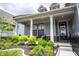Inviting front porch with elegant columns and landscaping, perfect for relaxing at 1580 Mairn Ave, Carmel, IN 46032