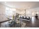 Bright and airy kitchen and dining area featuring a kitchen island, modern fixtures, and ample seating space at 1580 Mairn Ave, Carmel, IN 46032