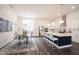 Expansive kitchen with a large island, stainless steel appliances, and seamless flow into the adjacent dining area at 1580 Mairn Ave, Carmel, IN 46032