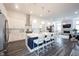 Modern kitchen boasts stainless steel appliances, a large center island with seating, and stylish pendant lighting at 1580 Mairn Ave, Carmel, IN 46032