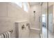 Elegant walk-in shower features tiled walls and a built-in bench at 1580 Mairn Ave, Carmel, IN 46032