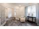 Bright and open sitting room with french doors and stylish hardwood floors at 1580 Mairn Ave, Carmel, IN 46032
