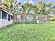 Exterior view of a brick home with a screened-in porch and well-kept yard at 15841 E 265 N, Columbus, IN 47203
