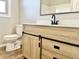 Bathroom featuring a stylish vanity with barn door accents and modern fixtures at 15841 E 265 N, Columbus, IN 47203