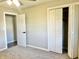 Bedroom featuring carpet floors, an open closet, and ample natural light at 15841 E 265 N, Columbus, IN 47203
