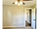 Bedroom featuring neutral walls and carpeted floor, with an open door at 15841 E 265 N, Columbus, IN 47203