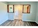 Dining area featuring elegant dark wood trim, contrasting with updated tile and paint at 15841 E 265 N, Columbus, IN 47203