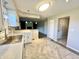 Updated kitchen with white cabinets, stainless sink, and eat-in bar area at 15841 E 265 N, Columbus, IN 47203