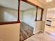 Open-concept living area with wood floors, visible from the front door at 15841 E 265 N, Columbus, IN 47203
