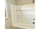 New shower with white tile, built in niche and modern fixtures at 15841 E 265 N, Columbus, IN 47203