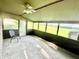 Enclosed sunroom with lots of windows, beautiful views and ceiling fan at 15841 E 265 N, Columbus, IN 47203