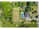 Aerial view showcasing a large backyard with a pool, and landscaped yard at 15920 Oak Park Ct, Westfield, IN 46074