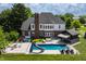 Stunning backyard oasis with a pool, slide, hot tub, outdoor bar and plenty of space for entertaining at 15920 Oak Park Ct, Westfield, IN 46074