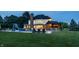 Beautiful backyard with pool, outdoor bar, slide, and lounge seating at 15920 Oak Park Ct, Westfield, IN 46074