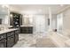 Bright bathroom featuring double vanities, soaking tub, and stylish gray tiled floor at 15920 Oak Park Ct, Westfield, IN 46074