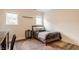 Bedroom featuring a wooden frame bed, textured accent wall, and natural light through a window for relaxation at 15920 Oak Park Ct, Westfield, IN 46074