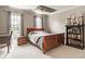 Bedroom with a queen-sized bed, two windows, trophy displays, and gray carpet at 15920 Oak Park Ct, Westfield, IN 46074