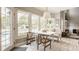 Inviting breakfast nook with natural light, table and chairs, and view of pool and backyard at 15920 Oak Park Ct, Westfield, IN 46074